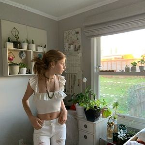 Cropped White Tank Top With ruffled sleeves.
